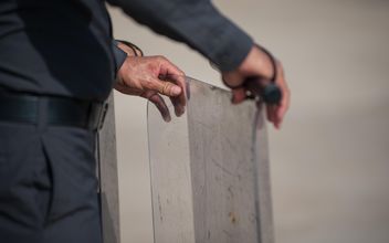 policeman holding a billboard - image gratuit #186319